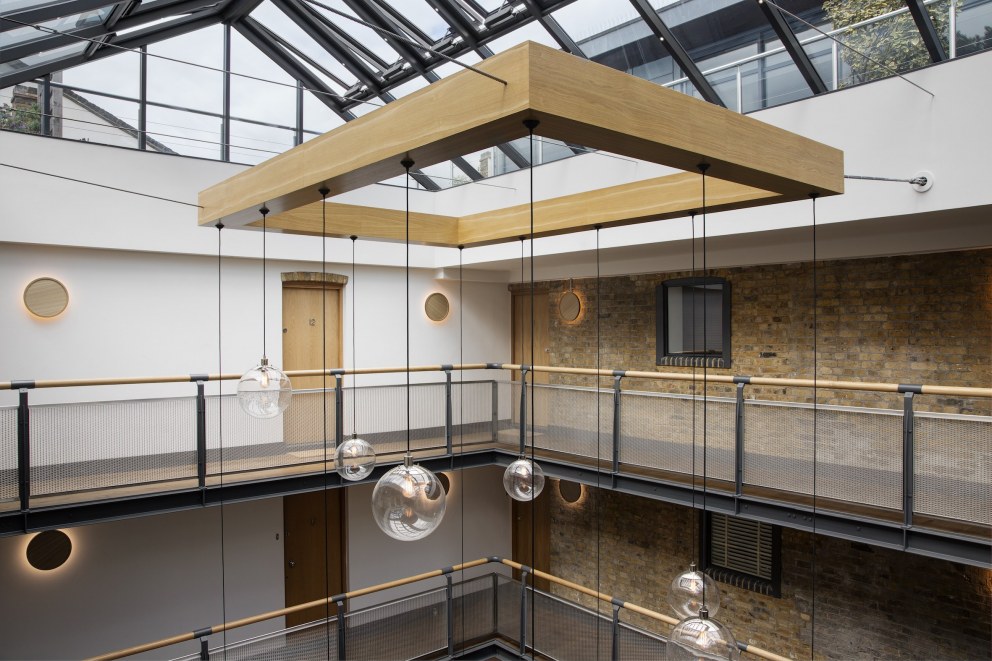Residential apartment building atrium - Wapping High Street | Bespoke industrial 12 pendant chandelier | Interior Designers